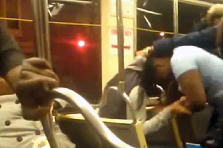 A screenshot from a video showing a brawl on a SEPTA trolley.