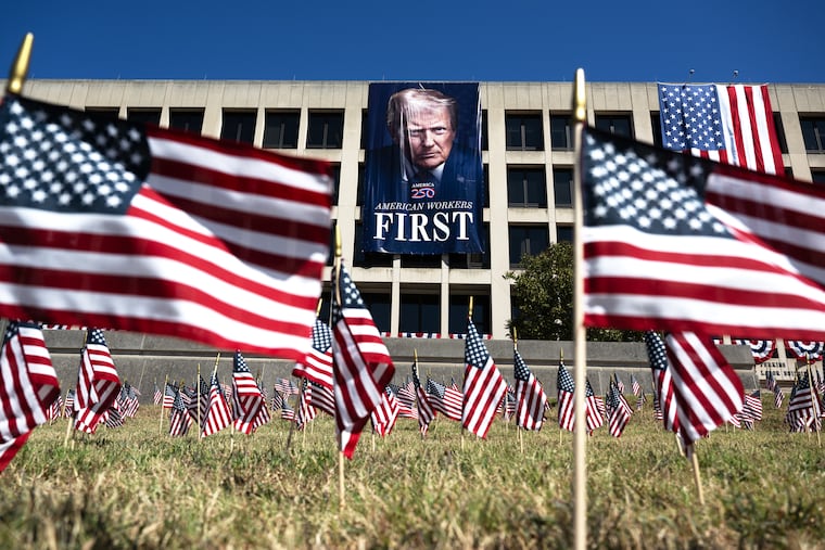A banner of President Donald Trump hangs on the Labor Department headquarters in Washington, D.C.