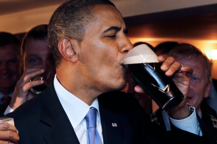 U.S. President Barack Obama drinks Guinness beer as he meets with local residents at Ollie Hayes pub in Moneygall, Ireland, the ancestral homeland of his great-great-great grandfather, in 2011.