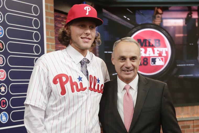 Phillies first-round pick Alec Bohm stands next to baseball commissioner Rob Manfred after being selected third overall Monday night in Secaucus, N.J.