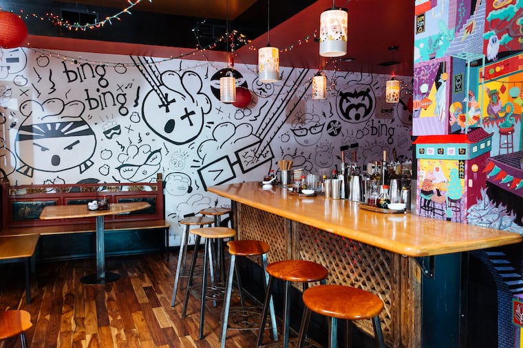 A mural covers the walls of the interior dining space at Bing Bing Dim Sum.