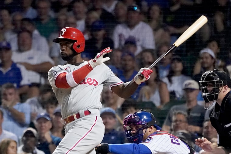 Andrew McCutchenn watches his RBI double off Chicago relief pitcher Rex Brothers, scoring Bryce Harper, during the sixth inning Monday.