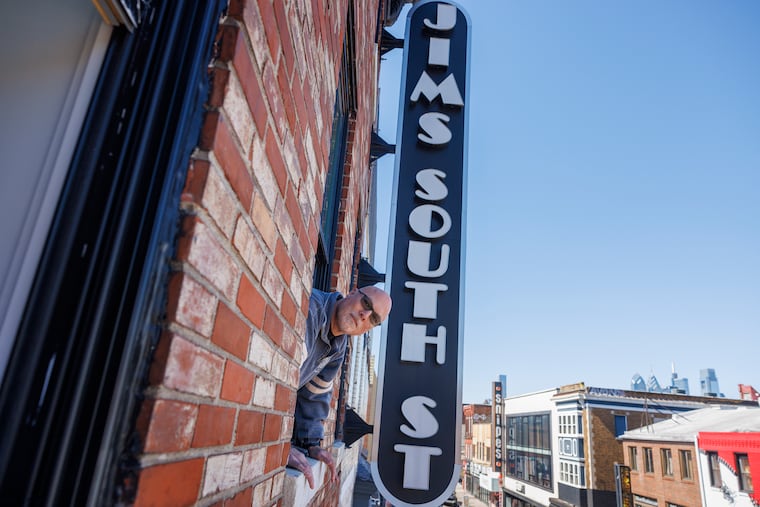 Ken Silver, owner of Jim’s Steaks, corner of 4th and South Street with sign on front of building.The restaurant is under construction after 2022 fire destroyed the cheesesteak restaurant. Photo taken on Monday, March 25, 2024.