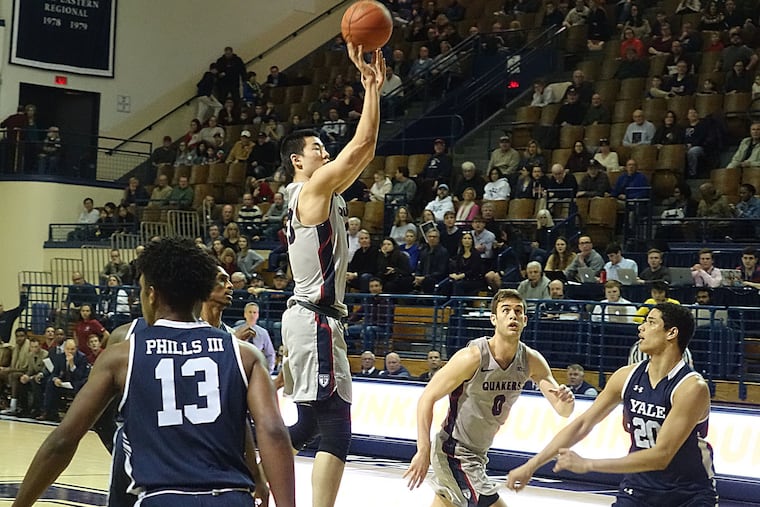 Penn's Michael Wang hits a jumper in the first half against Yale.