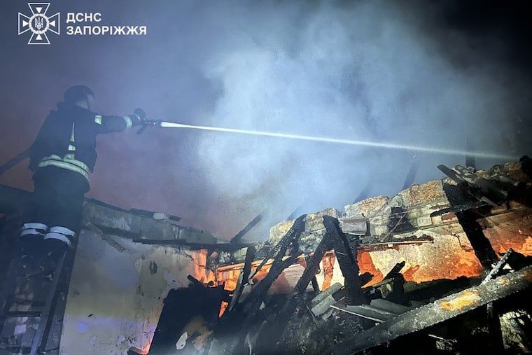 In this photo, provided by the Ukrainian Emergency Service, firefighters extinguish a fire in a residential building following a Russian drone attack in Zaporizhzhia, Ukraine, Friday, June 26, 2026.