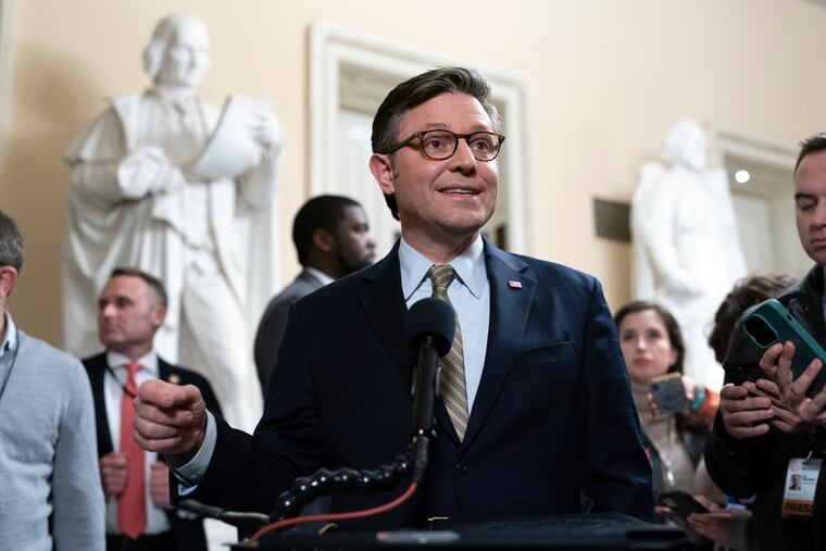 Speaker of the House Mike Johnson, R-La., talks to reporters after passing the funding bill to avert the government shutdown at the Capitol in Washington in mid-December.