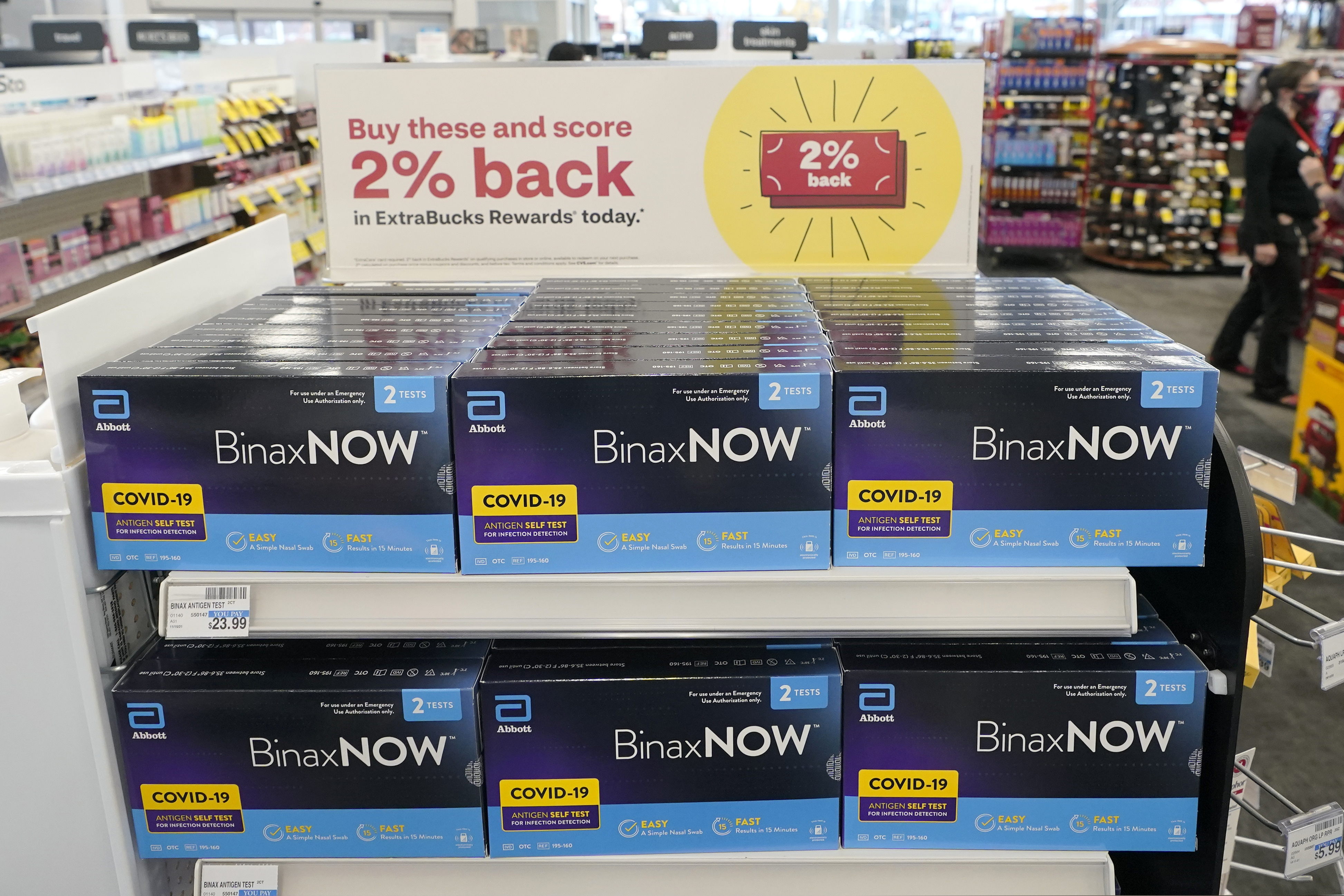 Boxes of BinaxNow home COVID-19 tests made by Abbott are shown for sale at a CVS store in Lakewood, Wash. The kits retail for $12 on the chain's website, far higher than home kits available in Europe.