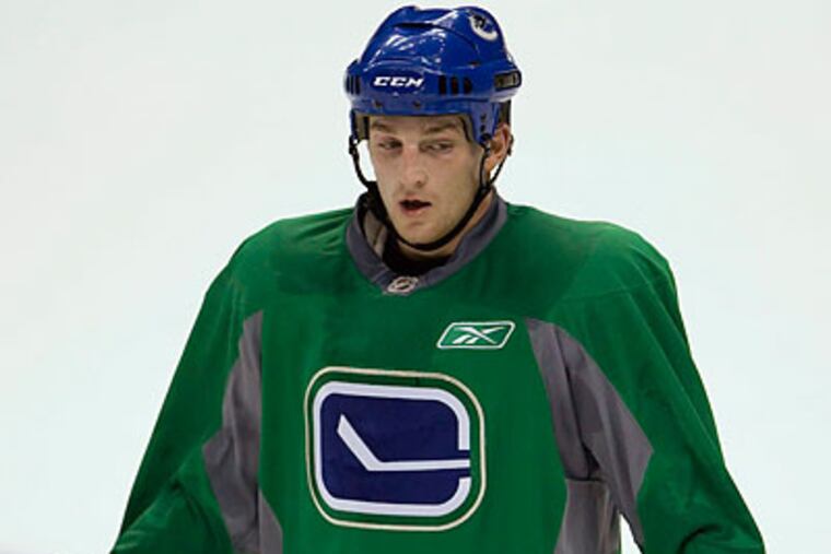 Rick Rypien is the second active NHL player found dead this offseason. (Jonathan Hayward/Canadian Press/AP file photo)
