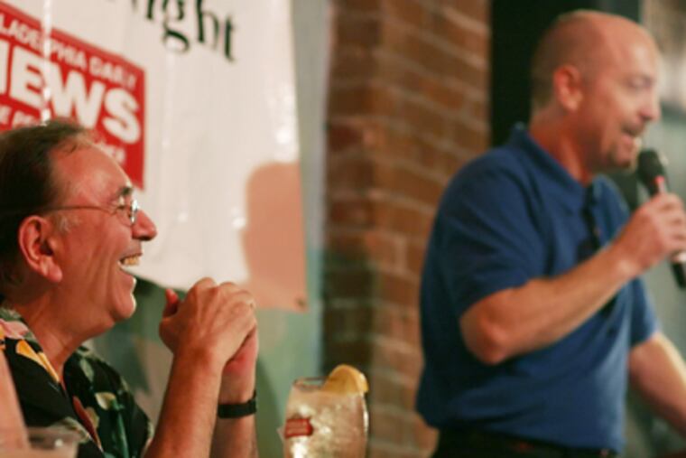 Stu Bykofsky (left) laughs as comedian Joe Conklin performs during the "Stu Bykofsky Candidates' Comedy Night" at Finnigan's Wake at 3rd and Spring Garden Streets. (File Photo)