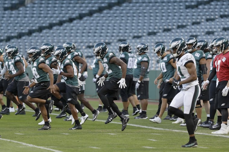 The Eagles warm up on the Angels Stadium field on Wednesday.