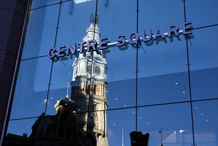 City Hall reflected in Centre Square at 1500 Market St. It is one of the many office buildings around City Hall that are struggling.