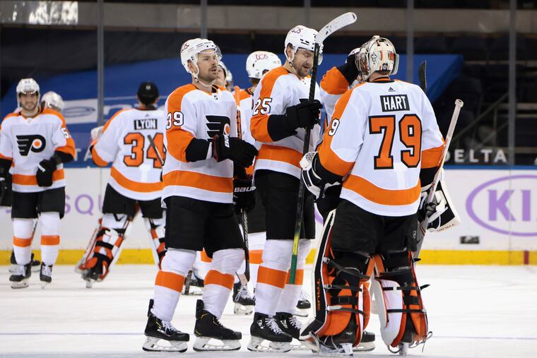 The Flyers celebrate their overtime victory over the New York Rangers.
