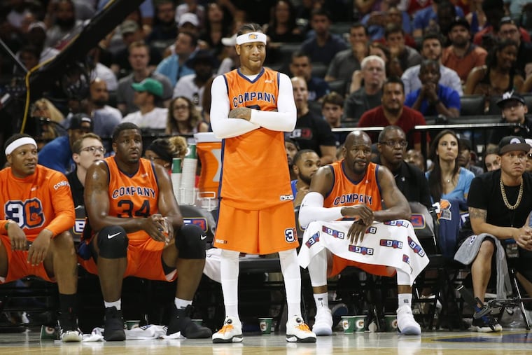 3's Company player/coach Allen Iverson (middle) watches from the sideline during a BIG3 game against the Ball Hogs on June 25 at the Barclays Center in New York.