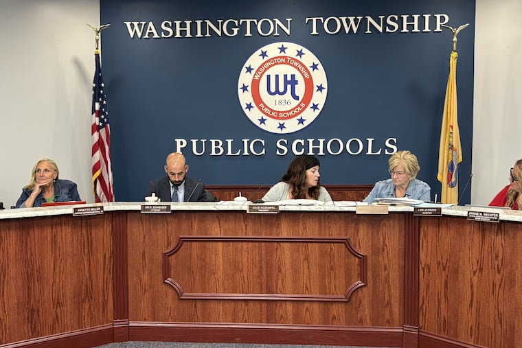 Washington Township School Board President Julie Kozempel (center) has been reprimanded by the state's School Ethics Commission for publicly sharing a text message from another board member about personnel.