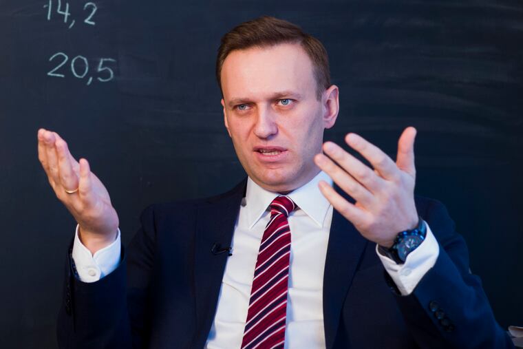 Russian opposition politician Alexei Navalny gestures while speaking during his interview to the Associated Press in Moscow, Russia, on Dec. 18, 2017.