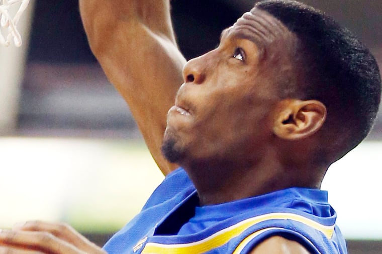 Vaux's Rysheed Jordan, top, dunks behind Johnsonburg's Mitch Holmberg in the second half of the PIAA Class A Boys Basketball championship game on Friday, March 22, 2013 in Hershey, Pa. Vaux won 83-63. (AP Photo/Keith Srakocic)