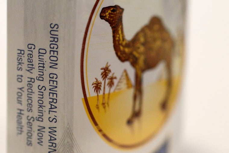The U.S. Surgeon General's Warning appears on a pack of Camel cigarettes in 2012.