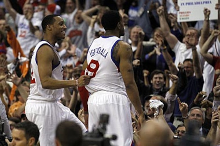 Evan Turner and Andre Iguodala celebrate the 76ers' Game 6 win over the Bulls on Thursday. (Yong Kim/Staff Photographer)