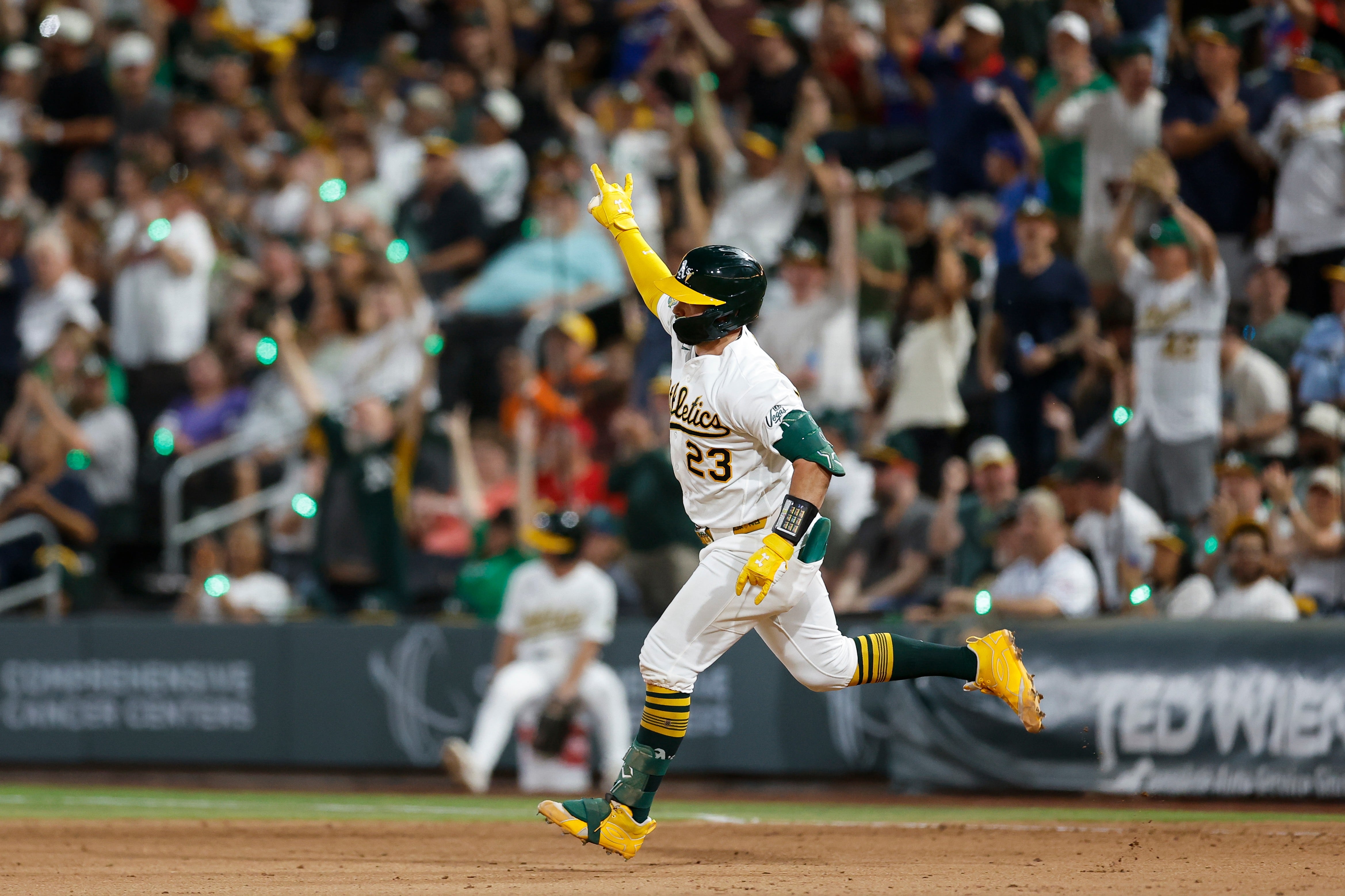 A's beat Rockies 6-4 as Lawrence Butler scores on a throwing error and adds an RBI single