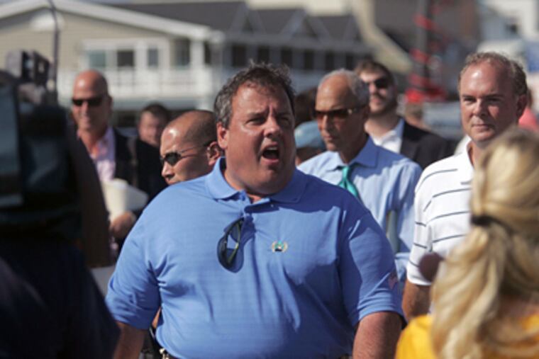 Gov. Christie walks the boardwalk of Belmar, N.J., Wednesday. (The Asbury Park Press, Tom Spader / Associated Press)