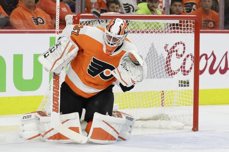 Flyers goaltender Brian Elliott stops the puck during the second period in the Flyers’ Game 3 loss to the Penguins on Sunday.