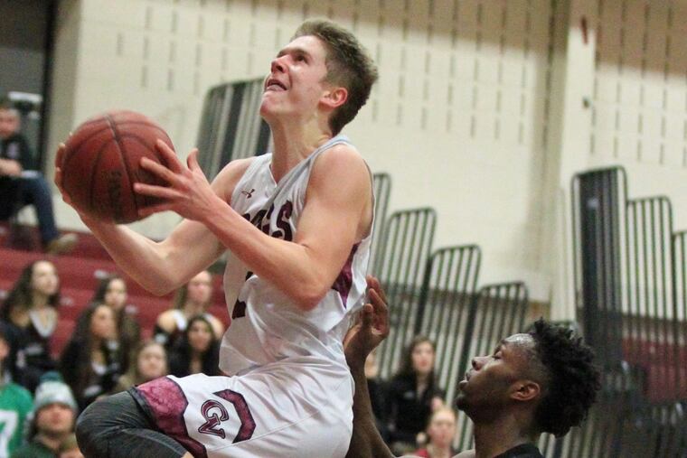 Garnet Valley’s Austin Laughlin (1) drives to the basket in Tuesday night’s game against Central League rival Lower Merion.