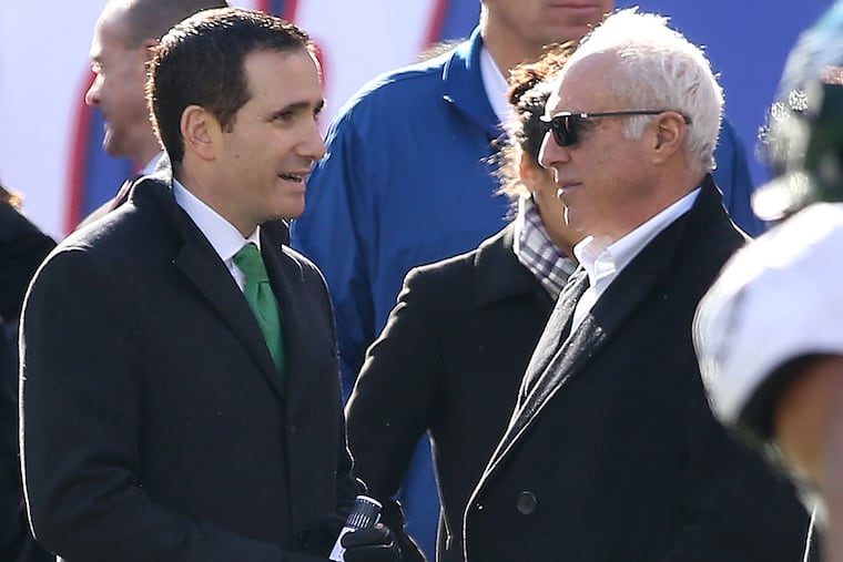 Howie Roseman (left) talks with owner Jeffrey Lurie.