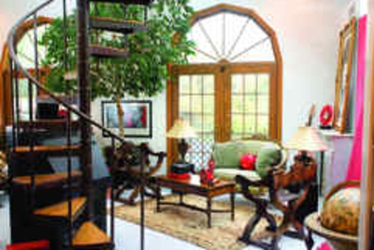 in the entertainment room on the second floor is left over from the house's previous life as a springhouse. The decor reflects the owners' taste. "We see furniture as art," Million said.