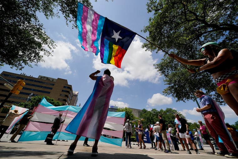 Demonstrators gather on the steps to the State Capitol to speak against transgender-related legislation bills being considered in the Texas Senate and Texas House in 2021 in in Austin, Texas. A Texas judge blocked the state from investigating as child abuse gender confirming care for transgender youth. District Judge Amy Clark Meachum issued a temporary injunction preventing the state from enforcing Republican Gov. Greg Abbott’s directive to compel the Department of Family and Protective Services to investigate.