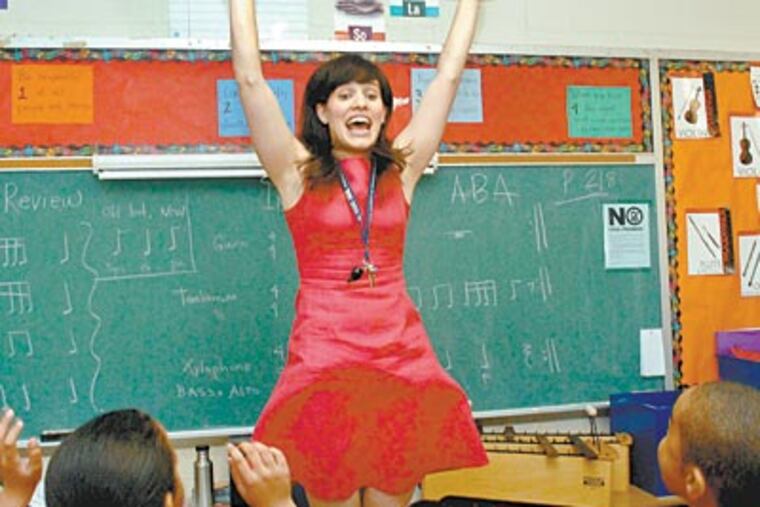 Music teacher Maura DiBerardinis resurrected, funded and popularized the music program at John Welsh Elementary in North Philadelphia. (April Saul / Staff Photographer)