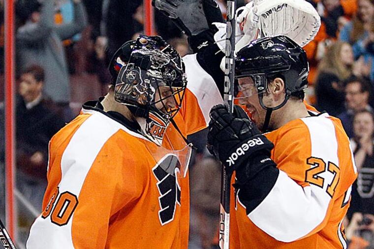 Flyers goalie Ilya Bryzgalov and teammate Bruno Gervais celebrate a win over the Montreal Canadiens. (Yong Kim/Staff Photographer)