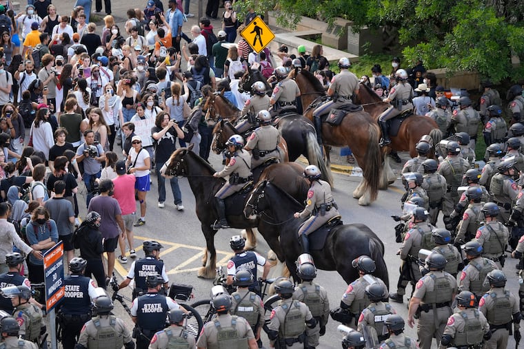 State troopers try to break up a pro-Palestinian protest at the University of Texas on Wednesday in Austin, Texas.
