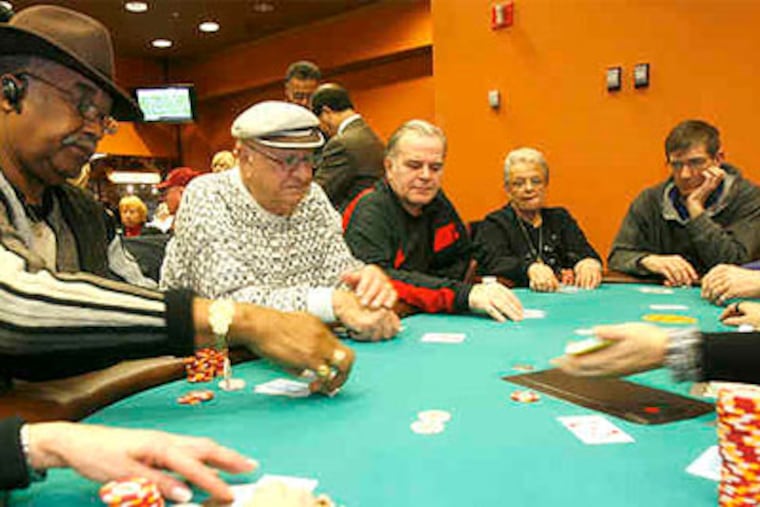 "Like a family" (from left) Don Madden, Mario Salvatore, Patrick Giallorenzo, and Angela Tortella, fiercely loyal stud poker players at the Taj. (Charles Fox / Staff Photographer)