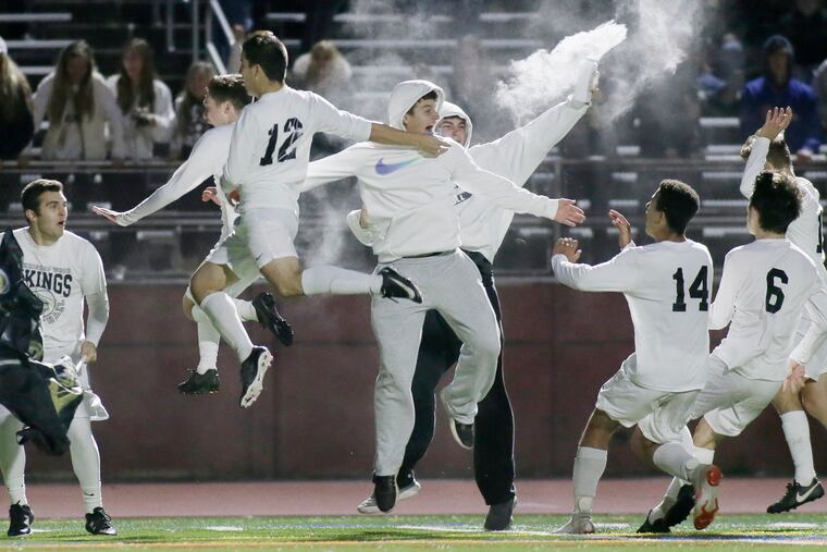 Archbishop Wood players run to fans after winning their Philadelphia Catholic League boys' soccer championship match in a shootout against Roman Catholic at the Northeast Supersite on Sunday, October 28, 2018.