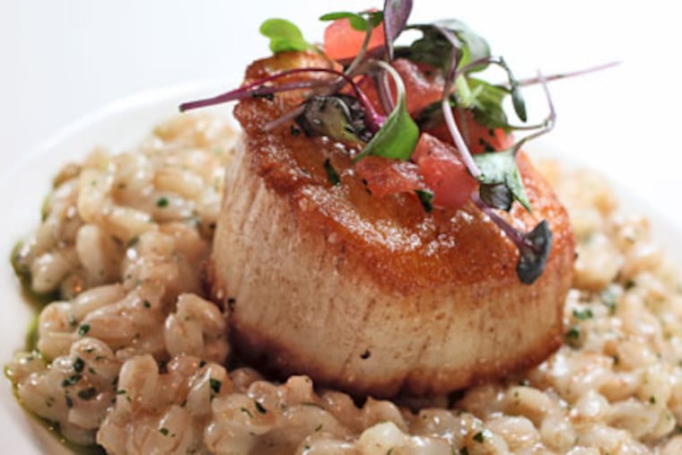 The farro “risotto” with seared day-boat scallop, below left, was one of the better dishes. (DAVID M WARREN / Staff Photographer)