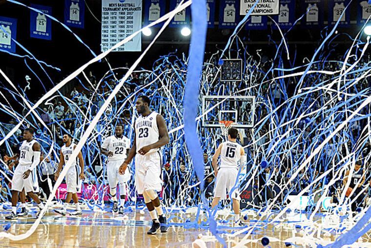Villanova fans throw blue and white streamers after Daniel Ochefu scored. (Clem Murray/Staff Photographer)
