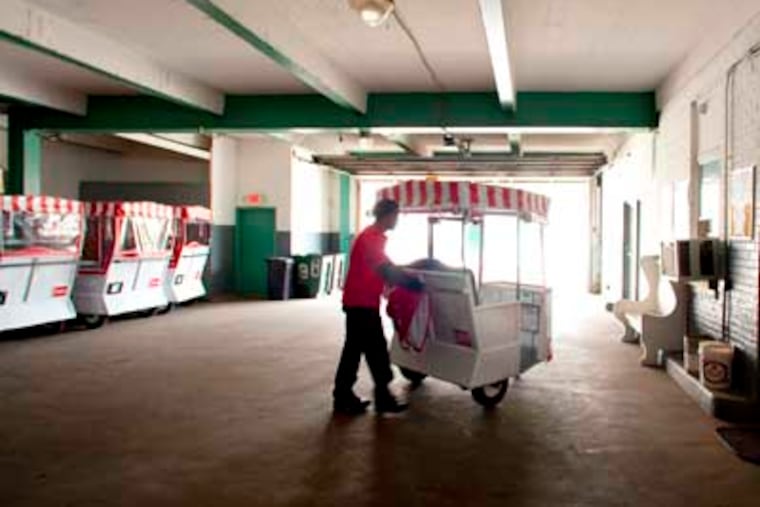 Jamar Medley heads for the boardwalk with his Royal Rolling Chair as he leaves the company's garage on New York Avenue in Atlantic City. ( ED HILLE / Staff Photographer )