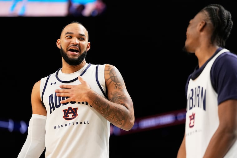 Auburn forward Johni Broome and guard Miles Kelly talks during practice at the Final Four of the NCAA college basketball tournament, Friday, April 4, 2025, in San Antonio.
