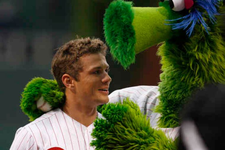 In Phillies pinstripes, Ryan Phillippe gets a consolation hug from the Phanatic. The Delaware native had failed to impress while throwing the first pitch before Tuesday's Phillies-Pirates game at Citizens Bank Park.