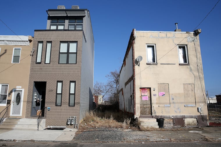 On the 2600 block of West Jefferson Street in Philadelphia, a newly constructed rowhouse has risen just feet from one in disrepair. Housing advocates are calling for developers to maintain the housing stock we have.