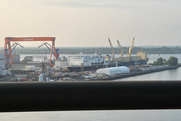 HMM Nabi, a 600-foot-long, newly built Korean bulk-cargo ship, sits in a former drydock at Hanwha Philly Shipyard, where it has unloaded fuel tanks and other imported parts for cargo ships Hanwha is building for Matson, which operates U.S.-built ships connecting U.S. ports.