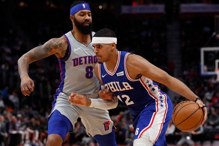 76ers forward Tobias Harris drives on Detroit Pistons forward Markieff Morris during the first half.
