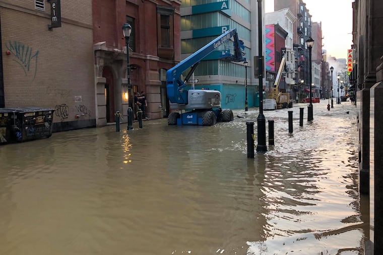 Sansom Street looking east after a water main break around 4 a.m. Tuesday, July 2, 2018, that flooded the streets in Center City.