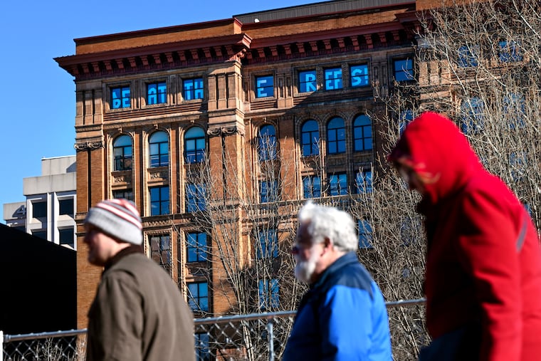 February 3, 2025: A handmade “Beat the Refs!” sign is posted on the top floor of the Bourse Building on Independence Mall.