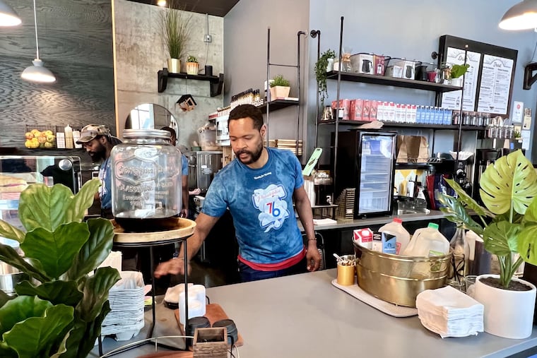 Owner Thane Wright behind the counter at Bower Cafe, 1213 Walnut St.