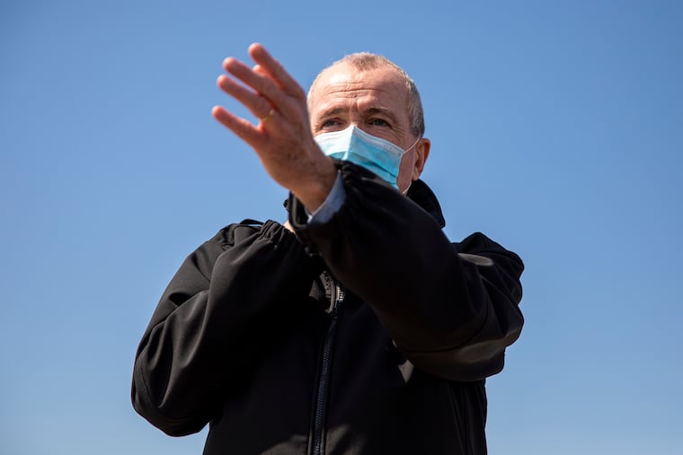 Governor Murphy speaks to press and answers questions along the damaged boardwalk in Wildwood on Tuesday.