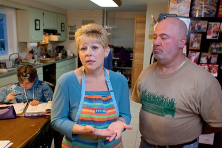 Susan Porreca, left, is part of an anti-Neshaminy teachers taxpayers group. She is with her husband Steve, right. (Ed Hille / Staff Photographer)