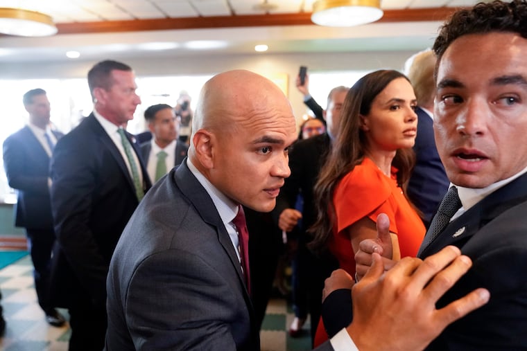 Former President Donald Trump's valet Walt Nauta, center, visits Versailles restaurant in Miami with Trump on June 13. Nauta is set to be arraigned on charges that he helped the former president hide classified documents that the Justice Department wanted back. Nauta was charged earlier this month alongside Trump in a 38-count indictment filed by Justice Department special counsel Jack Smith.