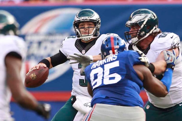 Mark Sanchez looks down field for a receiver. (Ron Cortes/Staff Photographer)