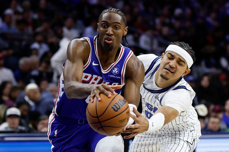 Sixers guard Tyrese Maxey drives past Orlando Magic guard Anthony Black during the second quarter on Monday, October 27, 2025 in Philadelphia.